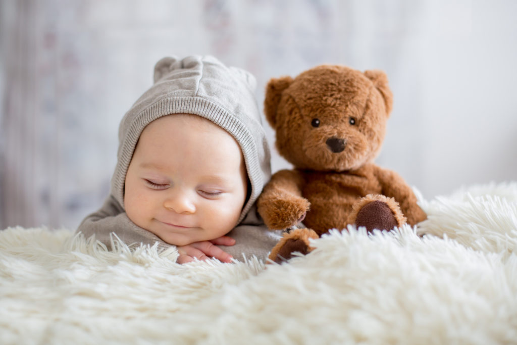 Sweet baby boy in bear overall