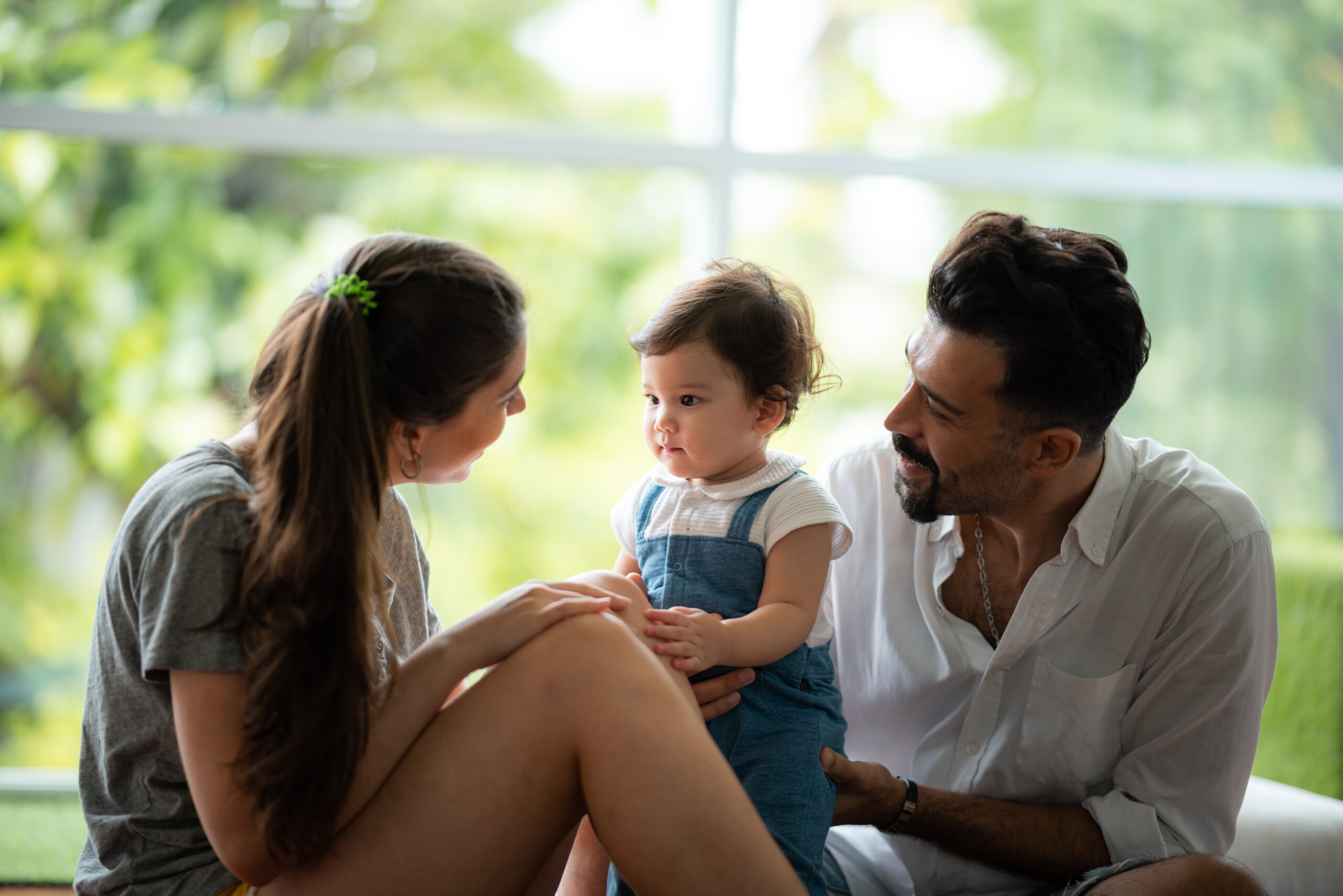 mexican young couple with a baby girl